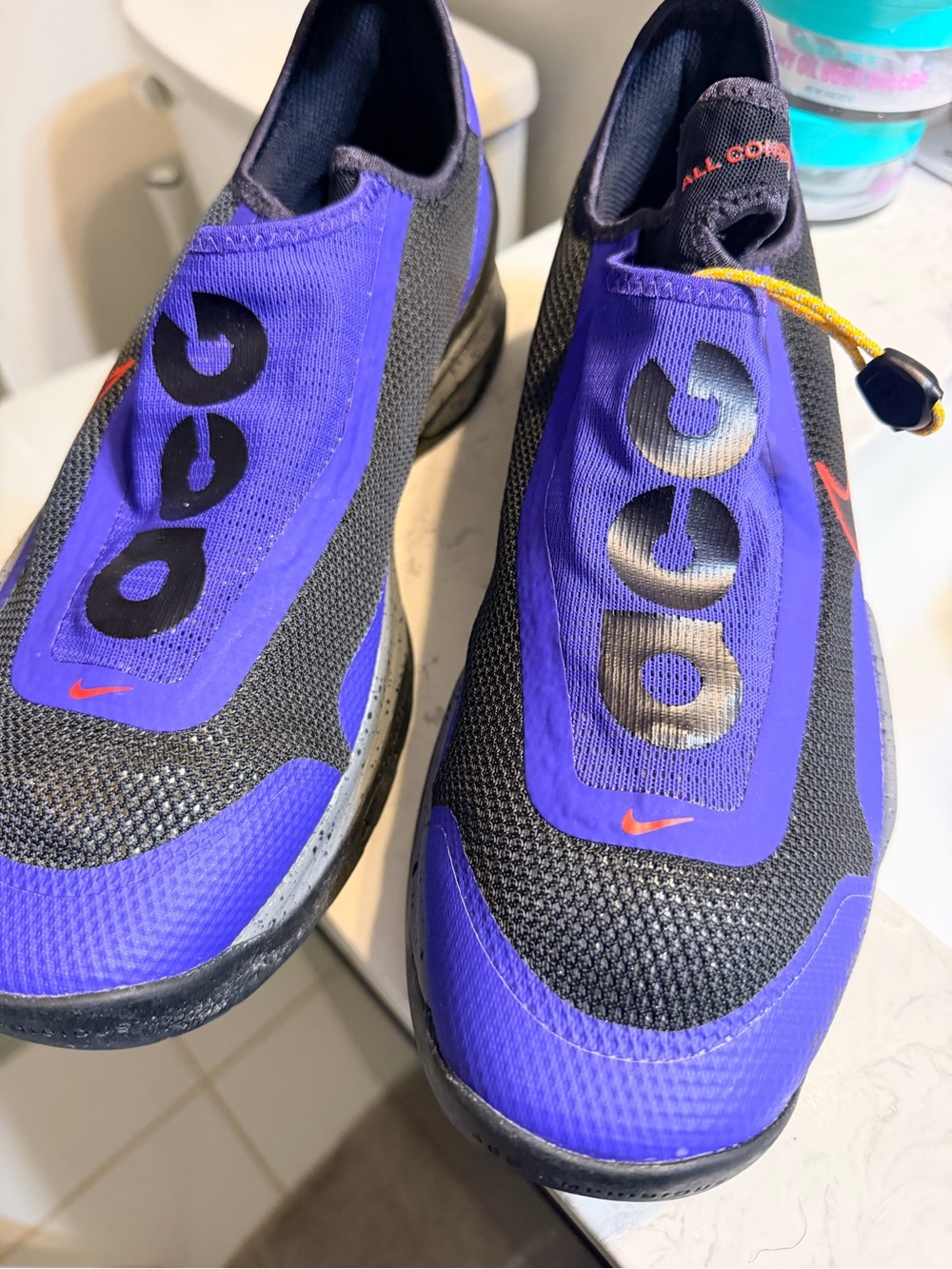 Nike men’s  Purple and Black Slip-On Athletic Sneakers with Orange Accents